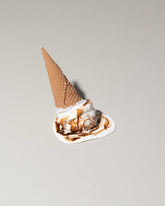 Spills Faux Chocolate Ice Cream Cone Spill on light color background.