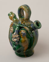 Closeup details of the Apotropaia Small Head Flask on light color background.