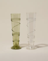 Bollenglass Design Green Small Spiral Vase and Clear Small Spiral Vase on light color background.