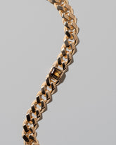 Closeup details of the Identity Chain Bicolor Chrysoberyl Bracelet 001 on light color background.