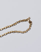 View from the back of the Attunement Necklace on light color background.