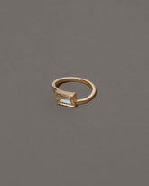 View from the side of the Jocundity Ring on grey color background.