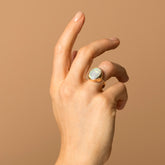 product_details::Australian Opal Ring on model.