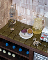 Styled image featuring the Dirty Martini Charm and Passionfruit Charm.