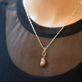 product_details::Gold Endless Clasp Charms and Bengal Curled-Up Cat Charm with the Hot Dog Chain Necklace on model.