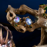 product_details::Styled image featuring the Cosmic Realm Earrings.