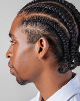 Classic Gold Solid Snack Hoop Earrings on male model.