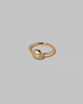 View from the side of the Gusher Diamond Ring 018 on light color background.