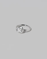 View from the side of the Gusher Diamond Ring 028 on light color background.