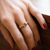 product_details::Sapphire Contort Ring on model.