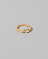 View from the side of the That Way Ring on light color background.