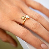 product_details::A past version of the Champagne & White Diamond Union Ring on model.