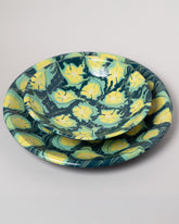 Closeup details of the Morgan Levine Clover Pasta Bowl and Morgan Levine Clover Platter on light color background.