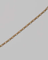 Closeup details of the Flat Oval Link Chain Necklace on light color background. on light color background.