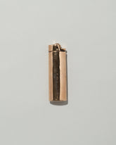 Pearce Objects Cast Bronze Lighter on light color background.