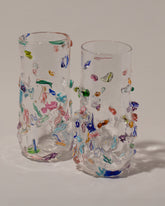 Closeup details of the Stover Glass Tall Cane Vases on light color background.