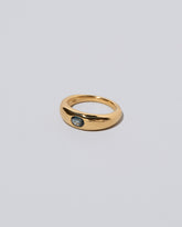 View from the side of the Blue Sapphire Venus Ring on light color background.