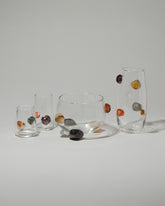 Jess Humphrey Studio Oblique Rocks Vase, Rocks Bowl, Rocks Vase, Petite Rocks Glass and Rocks Glass on light color background.