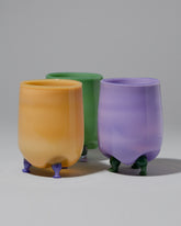 Group of Ornamental by Lameice Mint & Lilac, Violet & Mint and Topaz & Violet Opaque Eye Candy Cocktail Glasses on light color background.