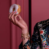 product_details::Strawberry Sprinkle Donut Charm on model.