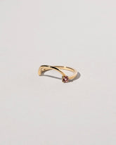 View from the side of the Yellow Gold Spinel Half Hoop Band on light color background.