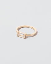 View from the side of the Tethys Diamond Ring on light color background.