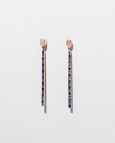 Peach Moonstone Transformation Earrings on light color background.