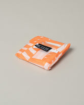 Baggu Peach Mociun Aerograph Print Baggu pouch on light color background.