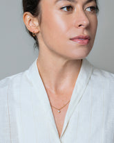 Brille Necklace on model.