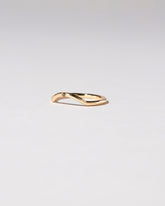Mini Curve Band - Single Stone on light color background.