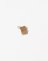 Toast Charm - with a Bite on light color background.