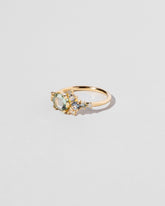 Hexagonal Slice Sapphire Cluster Ring on light color background.