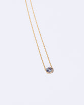Occam's Necklace on light color background.