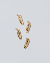 Demi Baguette Charms on light color background.