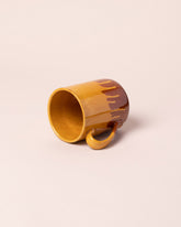 Del Monaco Coffee Mug on light color background.