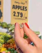 Red Apple Core Charm on model.