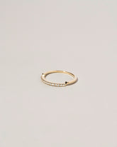 View from the side of the Gold Notched Band on light color background.