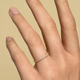 product_details::Gold White Diamond Fifteen Stone Dot Band on model.