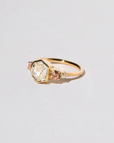 Theia Ring on light color background.