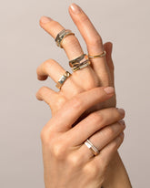 Gold Segmented Half Hoop Bands on model.