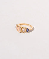 Larkspur Ring on light color background.