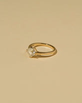 View from the side of the Cushion Modified Brilliant Diamond Solitaire Ring on light color background.
