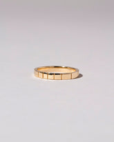 Closeup details of the Gold 2mm Etched Lines Bands on light color background.