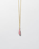 Rhodolite Drop Pendant on light color background.