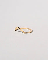 View from the side of the Gold Solid Square Wire High Peak Band on light color background.