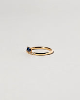 Stacked Ring - Sapphire & White Diamond on light color background.