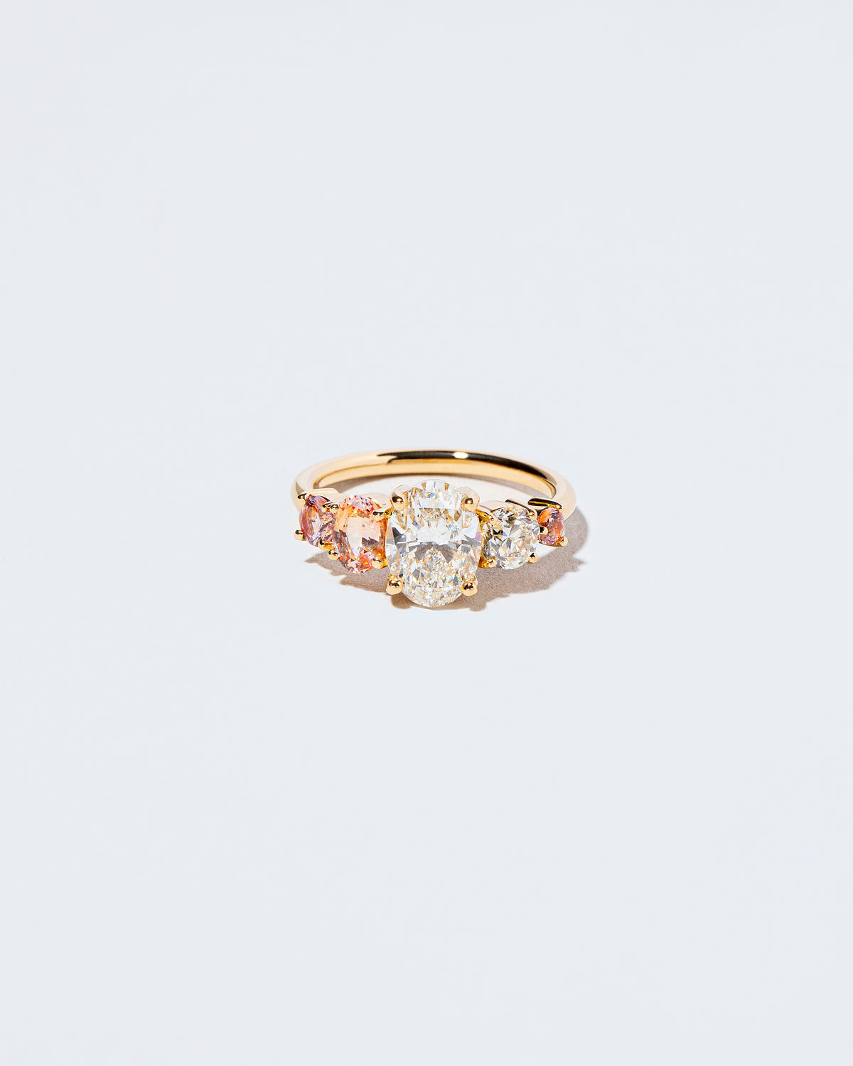 Brilliant Oval Diamond & Sapphire Line Cluster Ring front facing