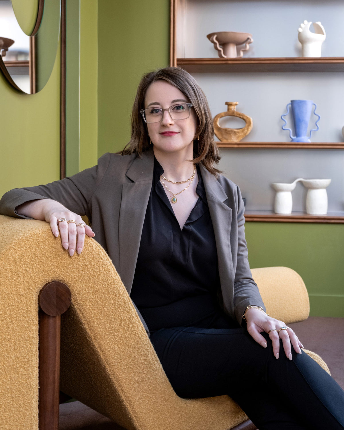 Mociun's Senior Fine Jewelry Specialist & Diamond Grader, Molly, seated in our fine jewelry showroom.