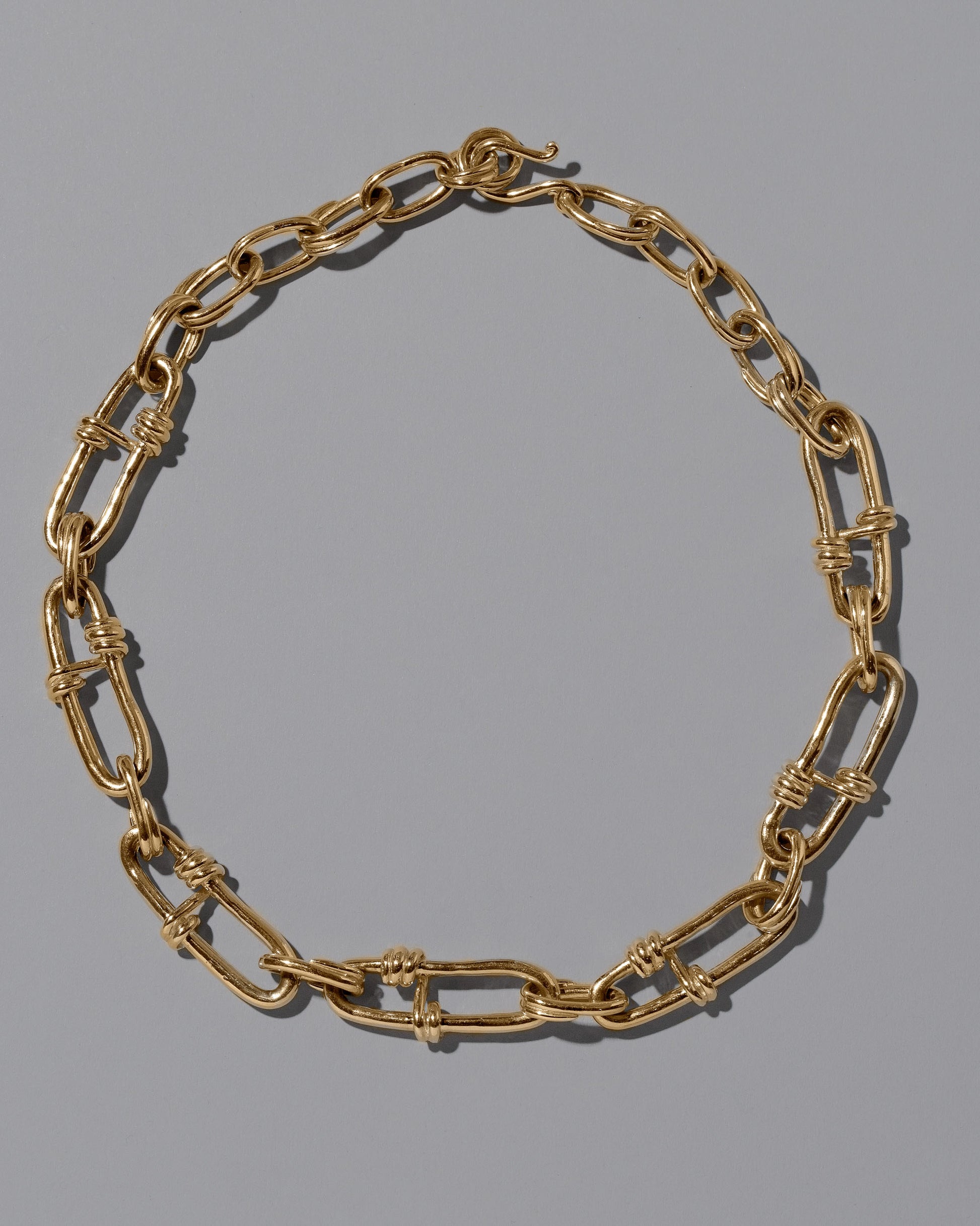 CRZM Gold Canyon Necklace on light color background.