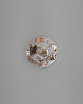 Silje Lindrup White Hands Two Orange Glass Wall Clock on light color background.